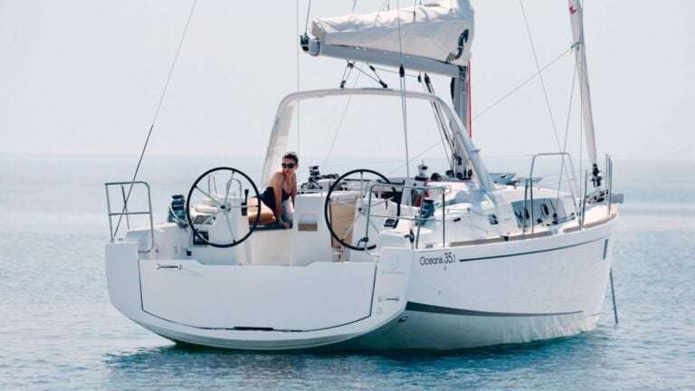 A woman relaxing on the deck of a Beneteau Oceanis 35.1.