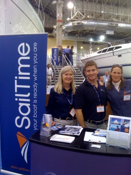 SailTime team members at a booth at a conference