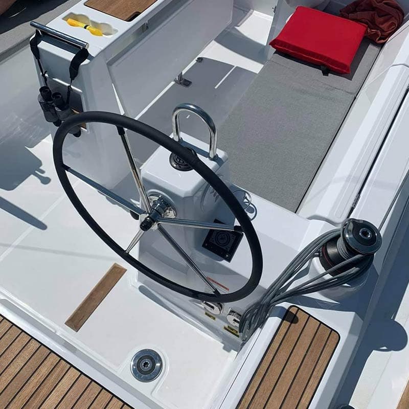 Closeup of the helm of a sailboat