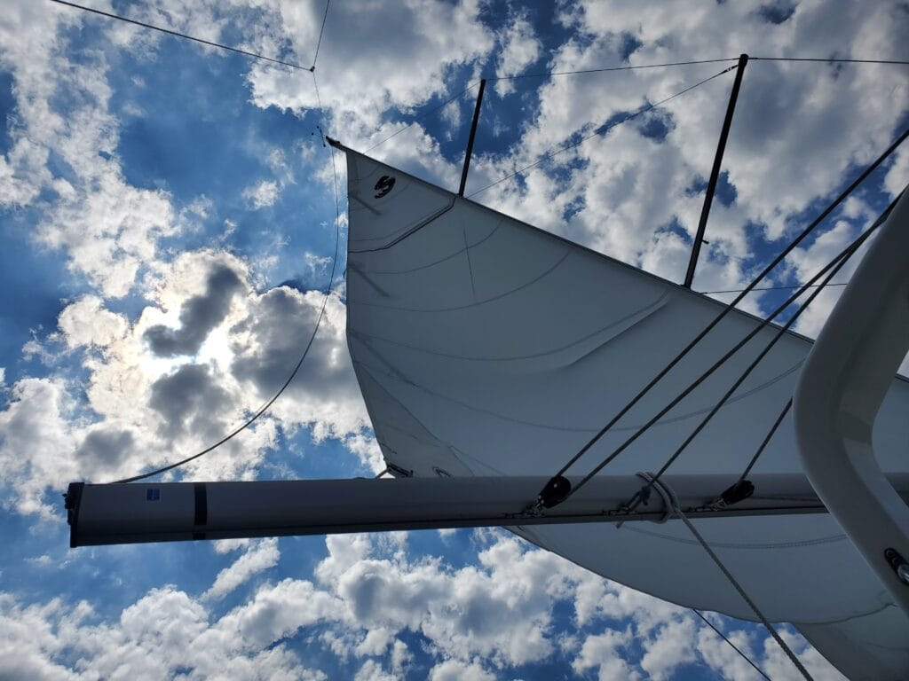 Sails extended with clouds in the background