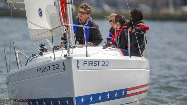 Crew sailing a Beneteau First 22