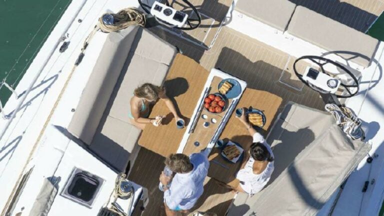 Group enjoying food on a Dufour 430 from above