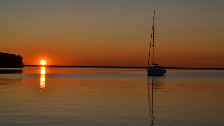 Sunset photo of a sailboat on the water