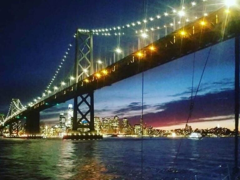 The Golden Gate Bridge from the water at nighttime