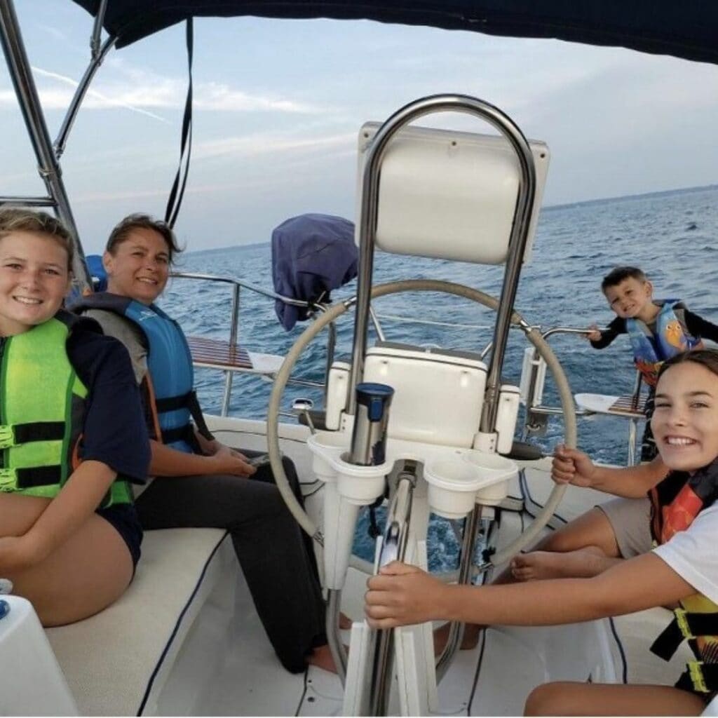 Kelly and her children sailing with SailTime Chicago.